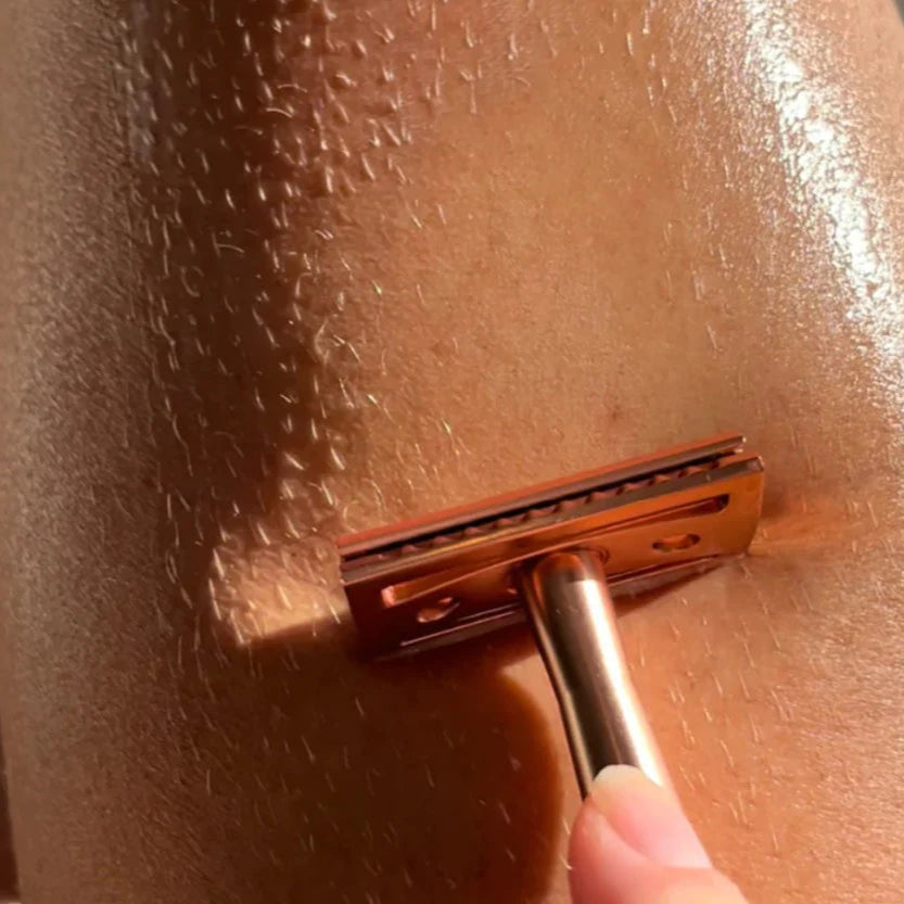 Close-up of a razor blade on skin