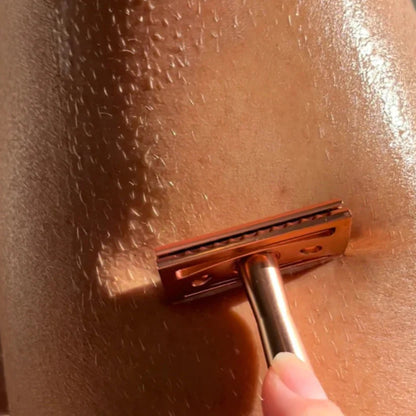 Close-up of a razor blade on skin